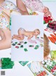 A woman laying on the ground next to a bunch of vegetables.